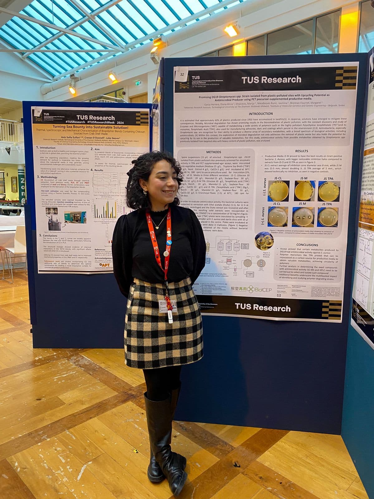 Diana Alicia Garza Herrera next to her poster presentation